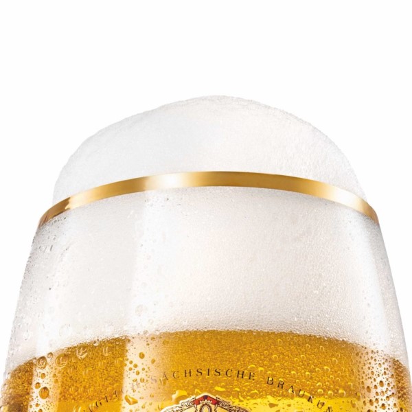 A close-up of a beer glass, showcasing sparkling golden beer topped with a thick white foam.